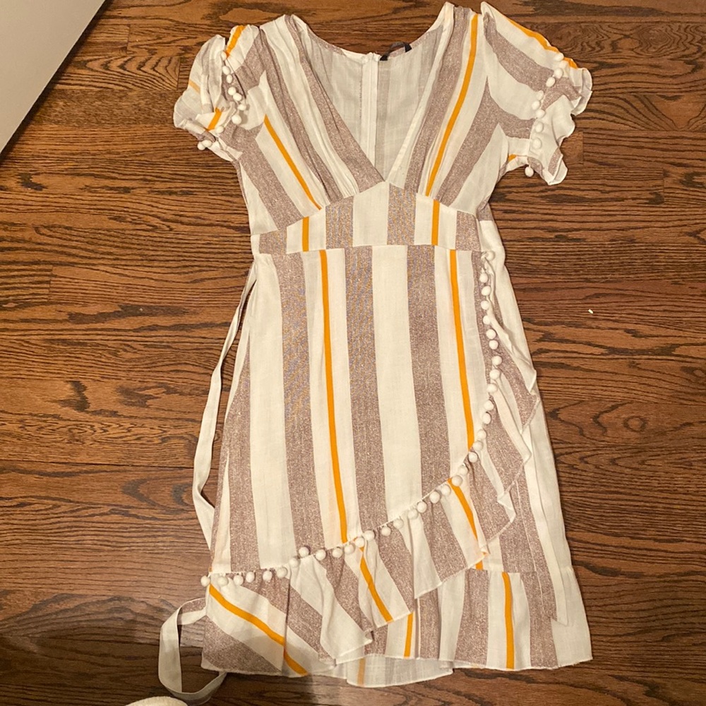 Large wrap dress with pom pom details